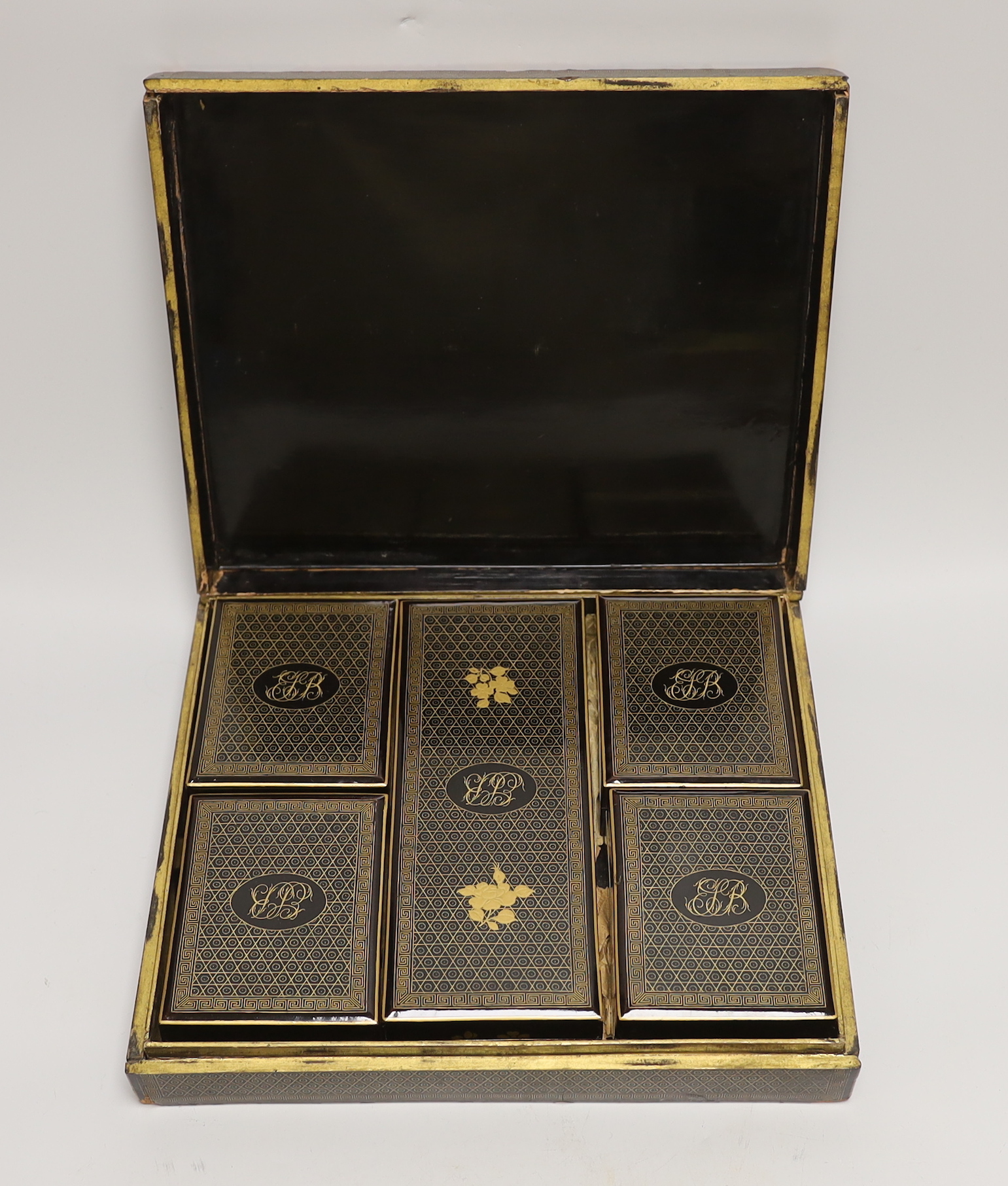 A mid 19th century Chinese export gaming set with mother of pearl counters, contained in a mid 19th century Canton gilt decorated like a box with lidded containers, 29cm